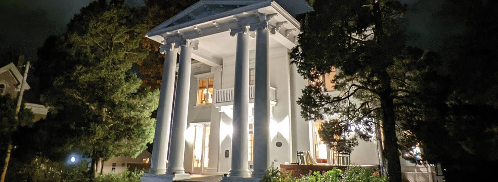 White house with columns at night