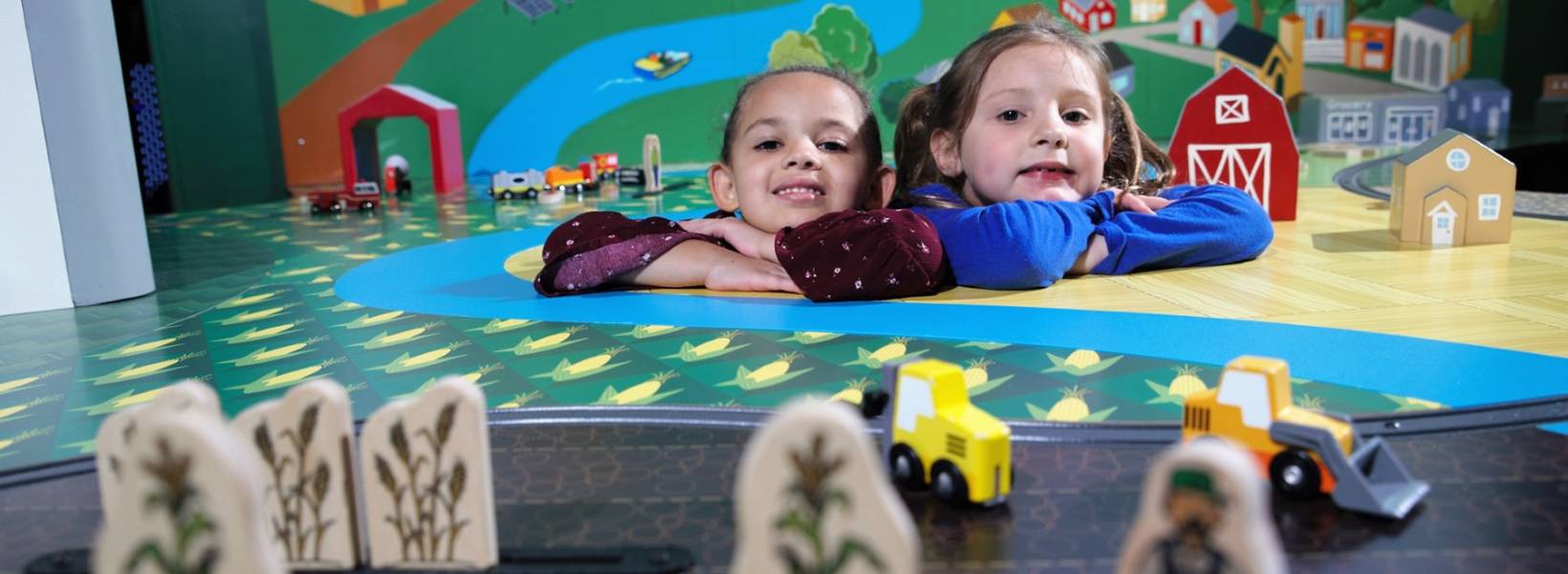 Two girls explore a museum exhibit