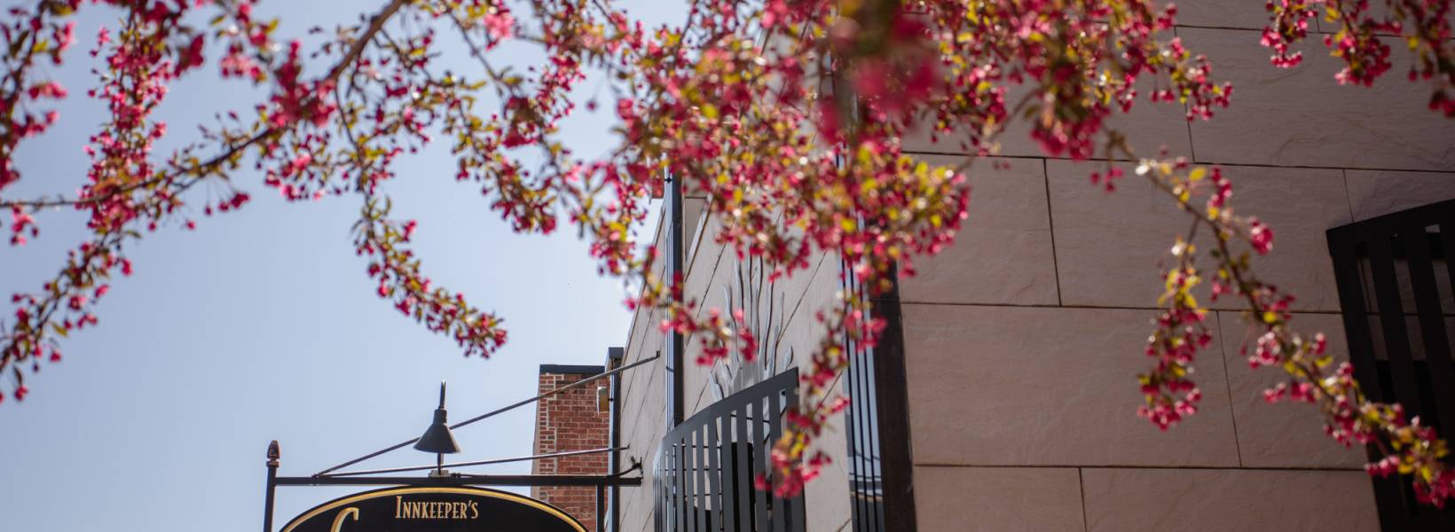 Sign on a building reading Innkeepers Coffee