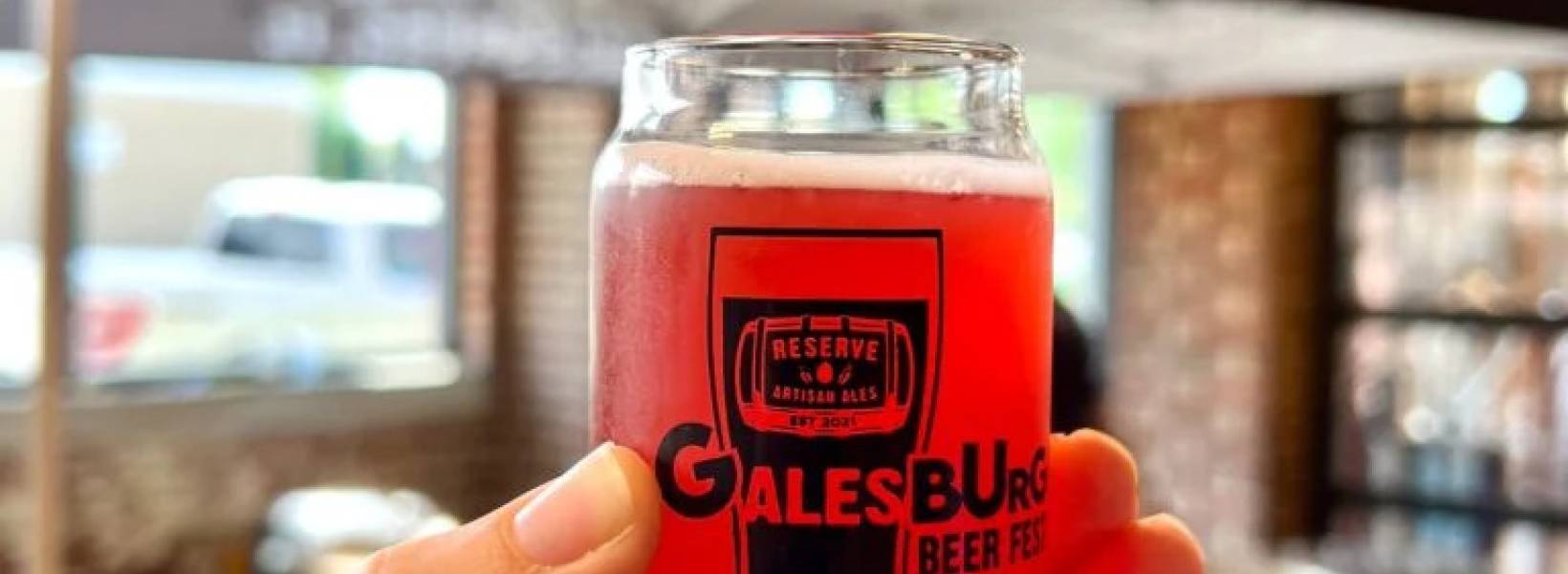 Image of a beer being held up with text about Galesburg