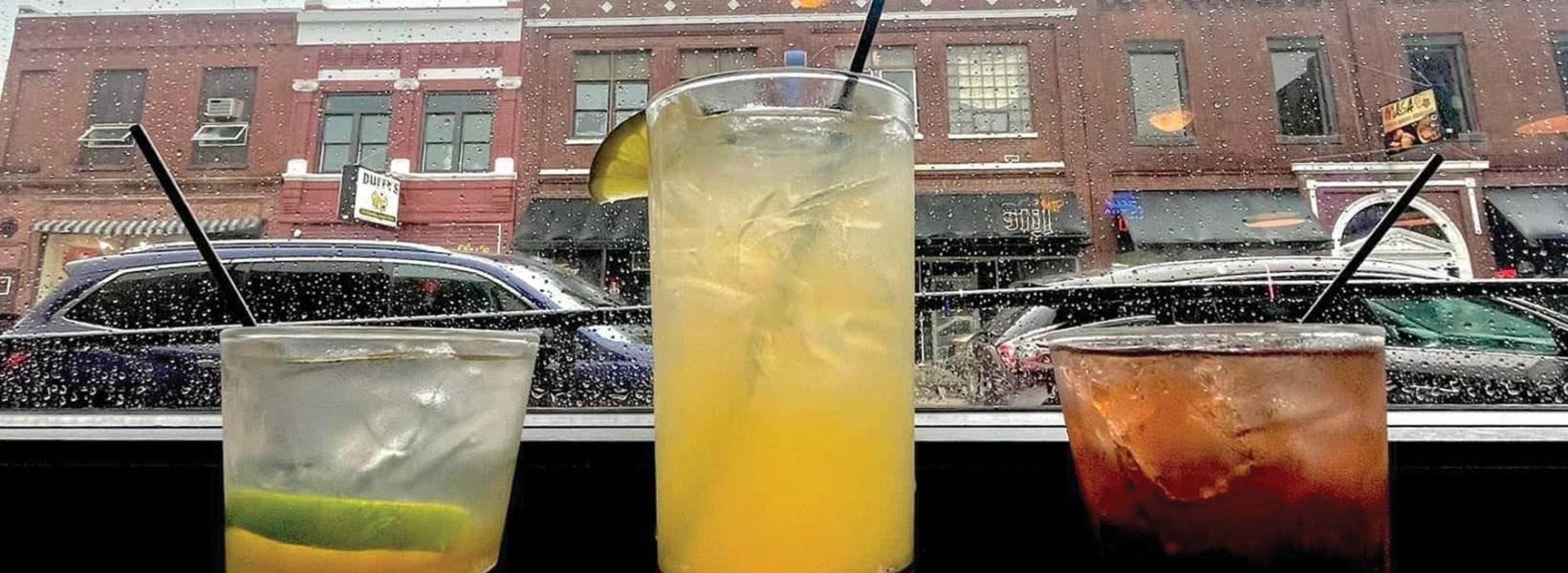 Three beverages on a ledge