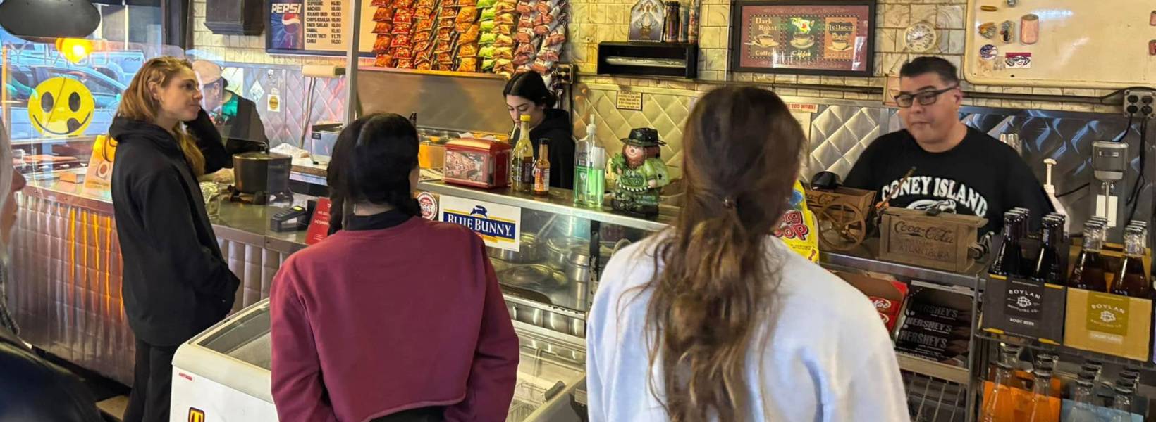 Image of guests at a restaurant counter